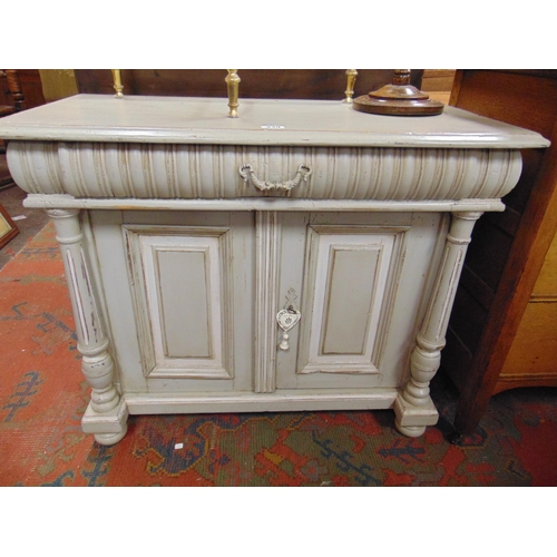 339 - Continental painted side cabinet, single long drawer, pair of cupboard doors flanked by turned colum... 