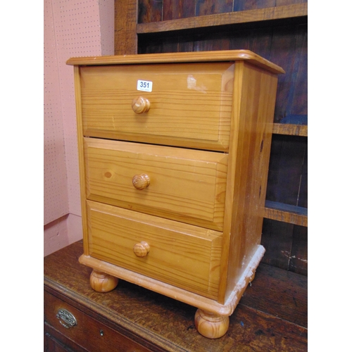 351 - Modern pine bedside chest of three drawers with knob handles.