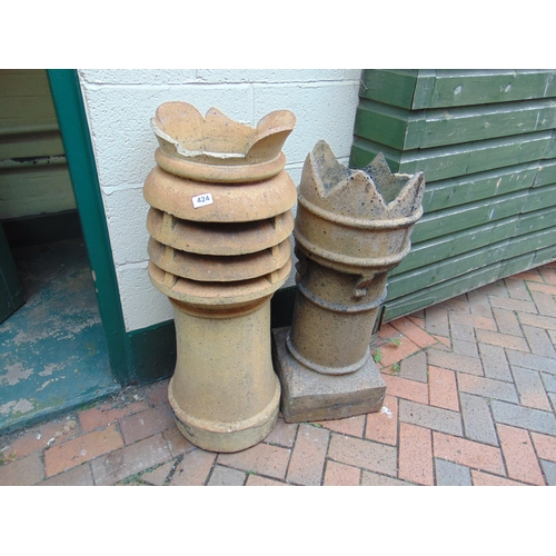 424 - Two antique chimney pots.