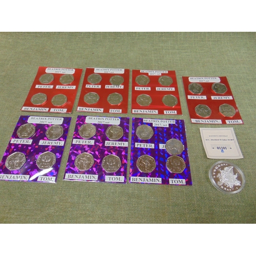 50 - Seven sets of Beatrix Potter 50p coins, and a commemorative coin with certificate.