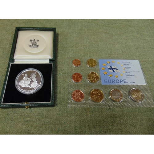 51 - Boxed set of 22ct gold plated coins, The History of British Currency, and a set of mint Euro coins.