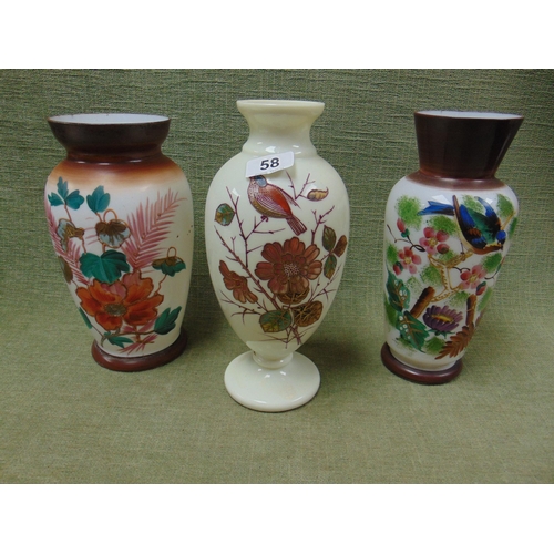 58 - Three floral painted opaque glass vases.