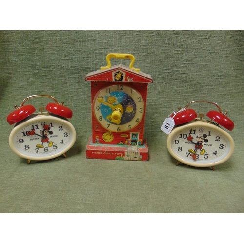 61 - Pair of Walt Disney Mickey Mouse alarm clocks, and a Fisher Price Toys Music Box Teaching Clock.