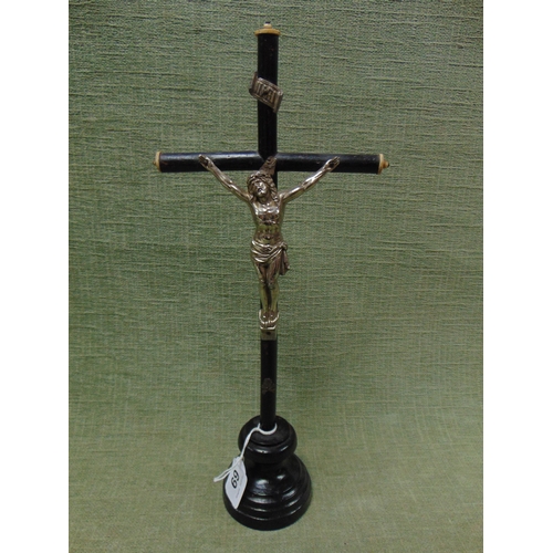 69 - Ebonised wood and metal crucifix, 16