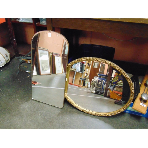 71 - Oval gilt framed wall mirror and an unframed wall mirror.