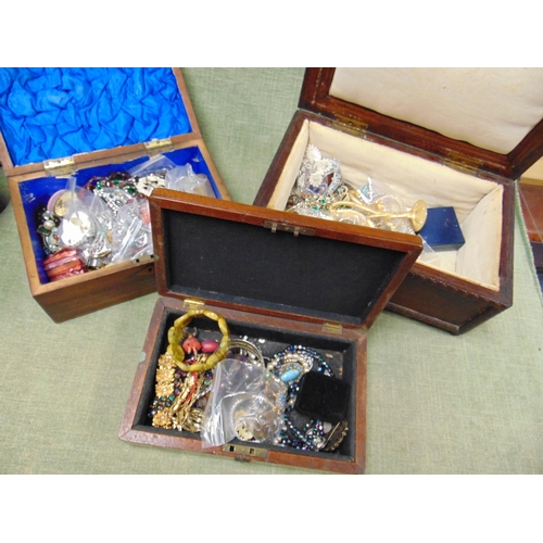 90 - Three wooden boxes containing a good selection of costume jewellery and trinkets.