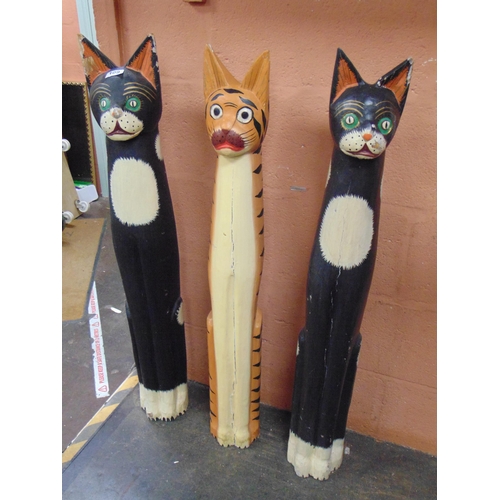 109 - Three tall painted wood cat figures, 39