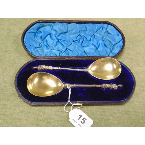 15 - Cased pair of antique gilt anointing spoons.