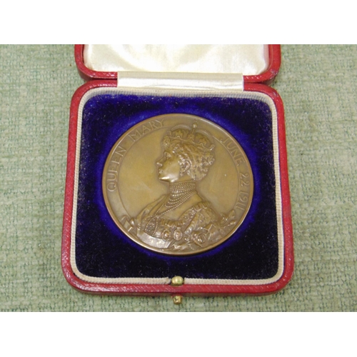 154 - Official 1911 copper Coronation medallion for King George V and Queen Mary, in red case of issue.