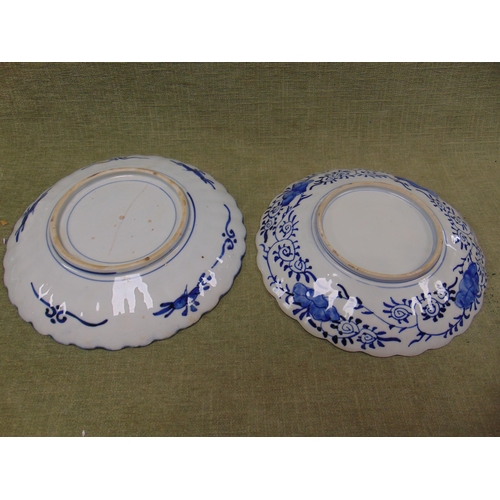 158 - Two late 19th century circular Imari dishes with traditional decoration and scalloped rims, 12