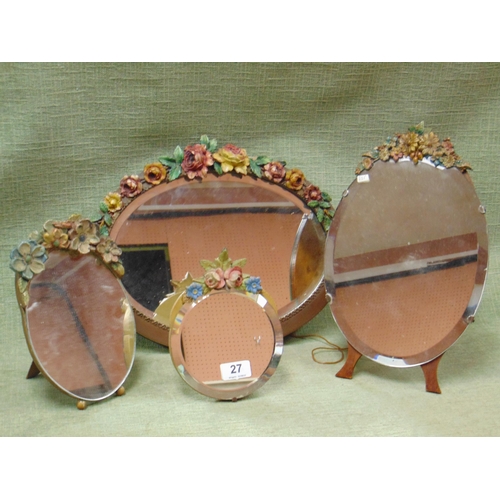 27 - Four various vintage dressing table mirrors with applied floral decoration.