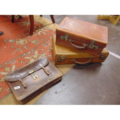 282 - Vintage leather satchel and two suitcases.