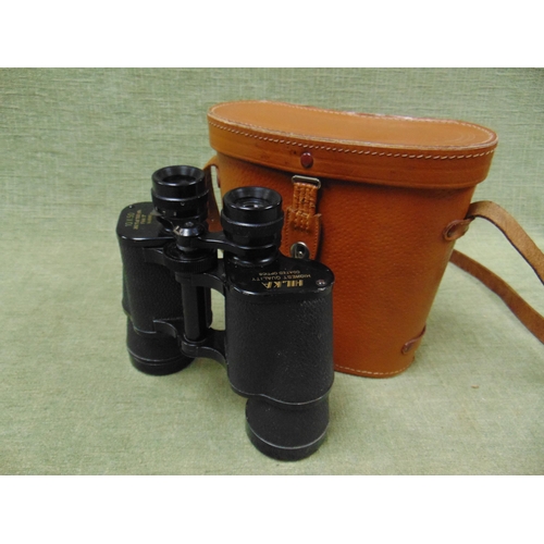 42 - Pair of Hilka 10 x 50 binoculars in pigskin case.