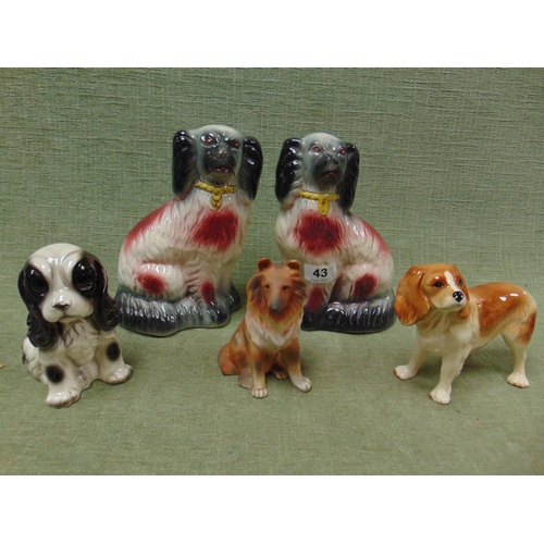 43 - Five various ceramic dog figures.