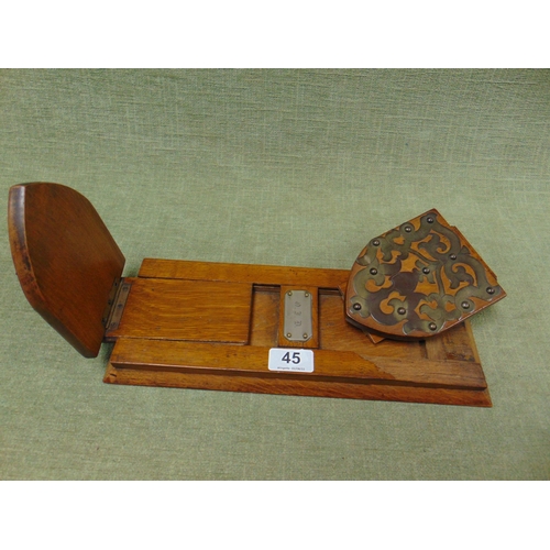 45 - Edwardian oak book slide with pierced brass mounts.