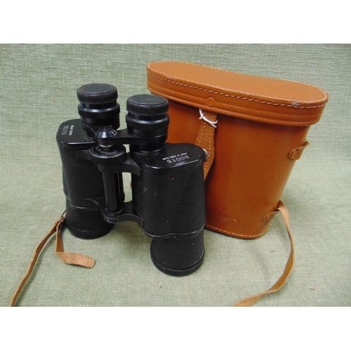 48 - Pair of Boots 10 x 50 binoculars in pigskin case.