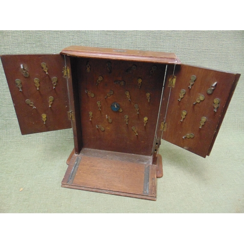 54 - Late 19th century mahogany three door key cupboard,