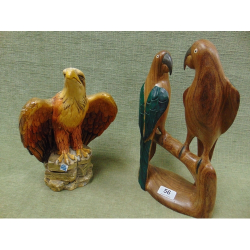 56 - Carved wooden group of two parrots, and a chalk eagle figure.