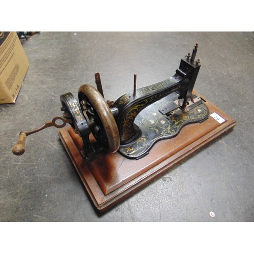 62 - Fisher Rossman manual sewing machine in case.