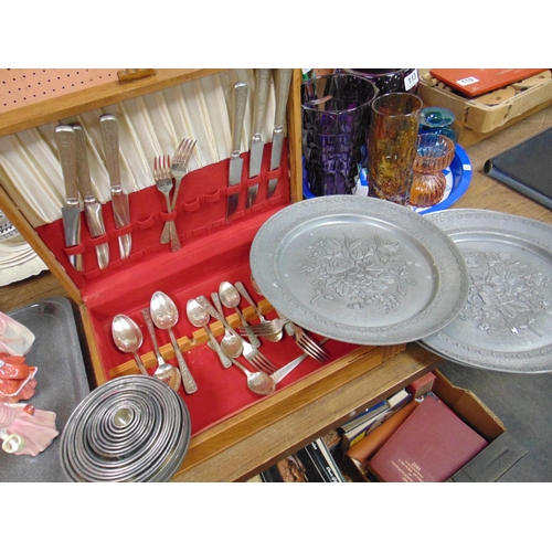 117 - Part canteen of cutlery, three continental pewter plates etc.