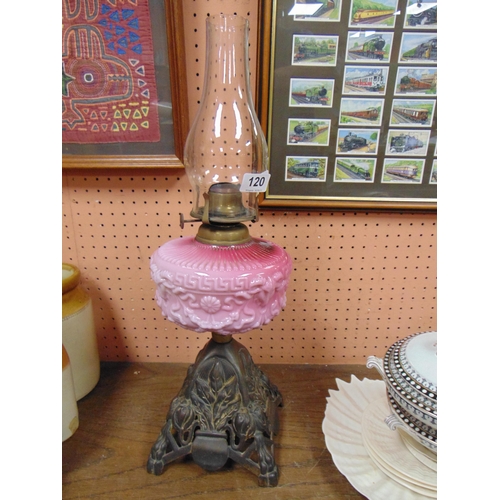 120 - Antique oil lamp with moulded pink opaque glass reservoir.