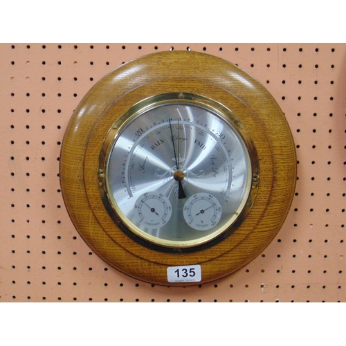 135 - Circular oak framed German barometer with thermometer and hygrograph.