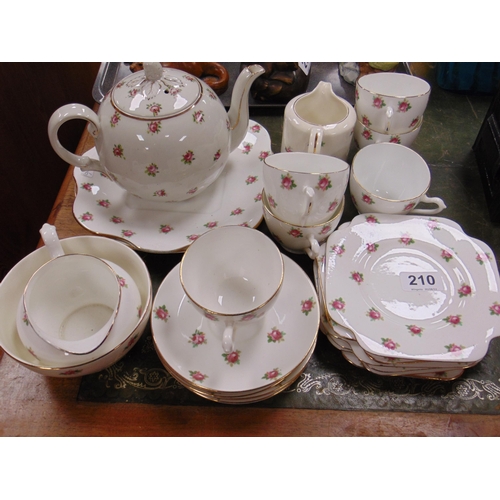 210 - Gilt edged floral tea set.