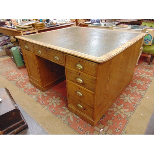 282 - An oak partner's desk, inset leather writing surface, drawers and cupboard doors to either side , an... 