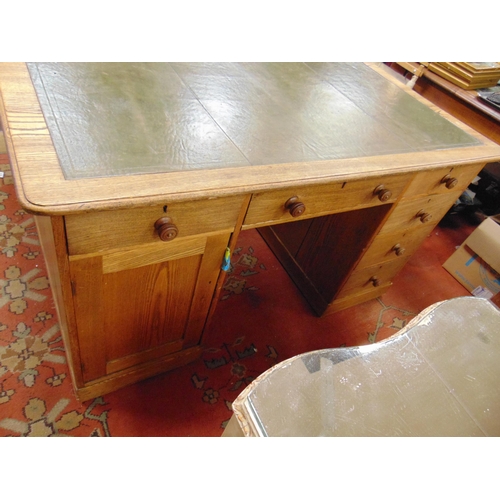 282 - An oak partner's desk, inset leather writing surface, drawers and cupboard doors to either side , an... 