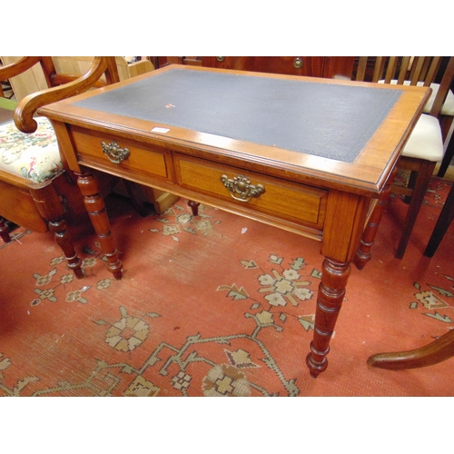 289 - Edwardian walnut writing table, inset leather top, two short drawers with metal handles and on turne... 