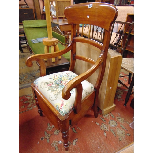 290 - Victorian mahogany commode arm chair.