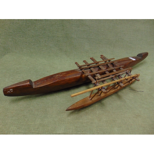 22 - Fijian carved wooden model of a native canoe with outrigger.