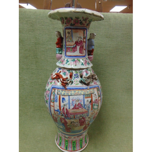 1 - Large oriental vase, having moulded figural sides, traditional familie rose decoration. 25