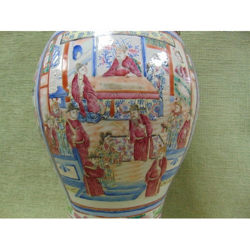 1 - Large oriental vase, having moulded figural sides, traditional familie rose decoration. 25