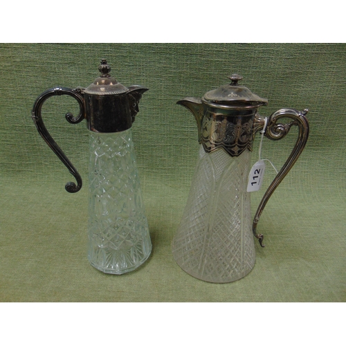 112 - Two moulded glass claret jugs, each having plated mounts.