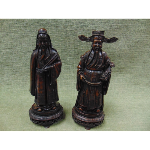 120 - Pair of resin figures, modelled as a pair of Oriental wise men, each 11