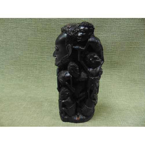 126 - Carved wooden African sculpture, modelled as a Man and  his children. 11