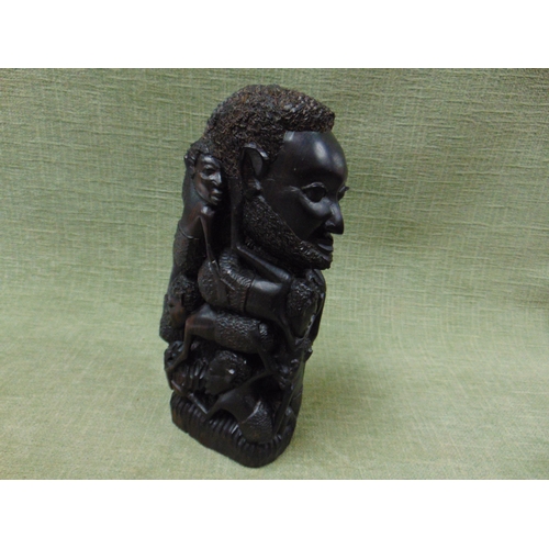 126 - Carved wooden African sculpture, modelled as a Man and  his children. 11