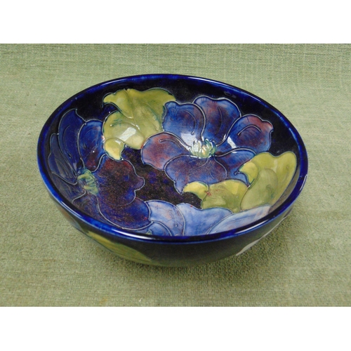 142 - Moorcroft Hibiscus pattern footed bowl, having original paper label.  6.5