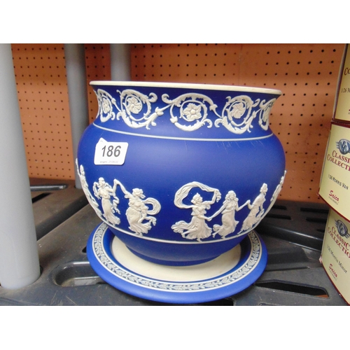 186 - Adams blue and white jardinière, decorated with classical figures, on  a circular stand. 8.5