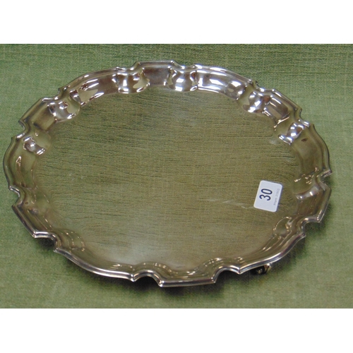 30 - Silver plated tray, shaped edge and on scroll feet.