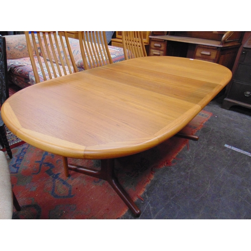 413 - Lauritis.M.Larsen , teak framed extending oval form dining table, having two extra leaves.85