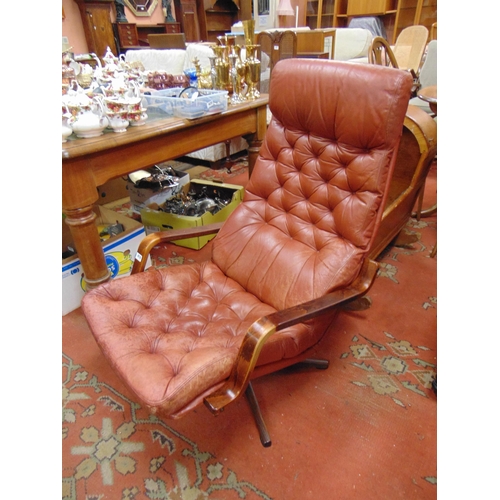 418 - Retro Danish leather chair , set on rosewood swivel base.