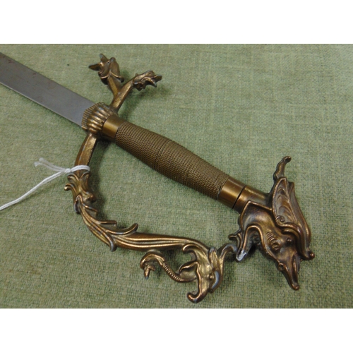 47 - Ornamental Eastern sword, having dragon head handle. 34