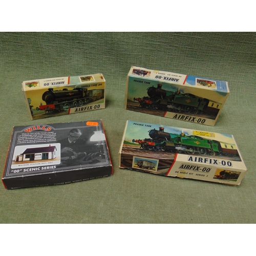 48 - Three boxed part built Airfix railway models, and one other.