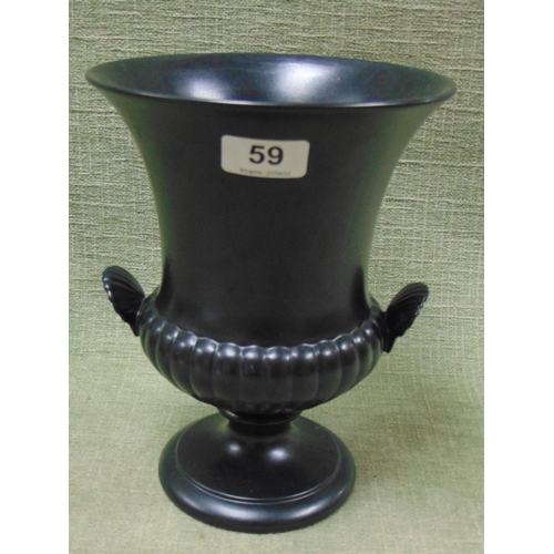 59 - Wedgwood Black glazed urn, having shell form handles and on footed base, 9.5