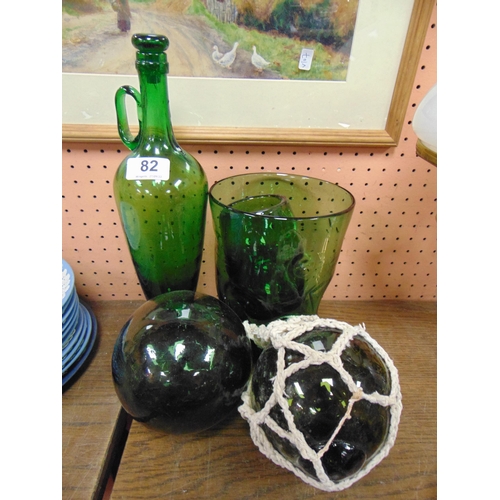 82 - Two green glass buoys, studio vase, etc.