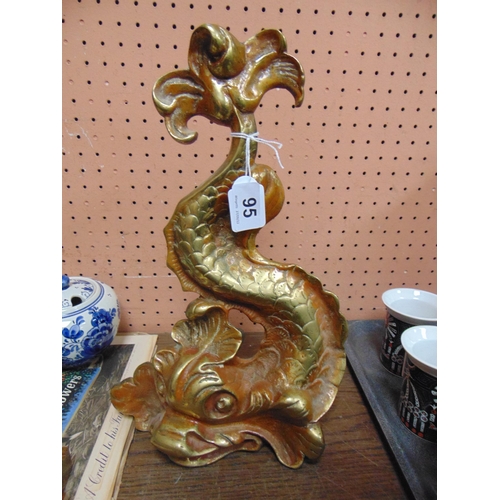 95 - Gilt painted cast iron sea serpent form door stop. 14