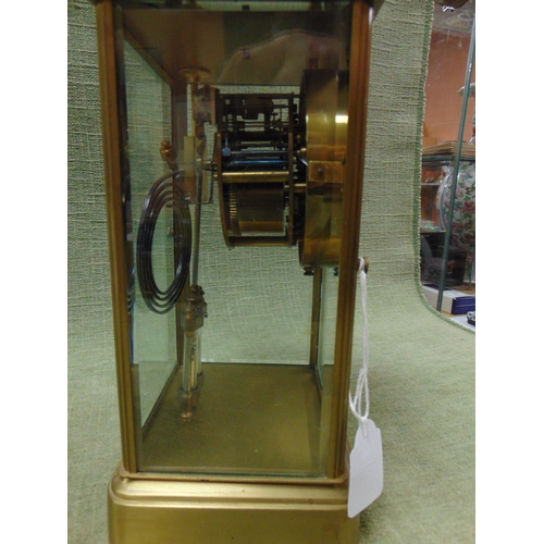 98 - Large 19th century brass carriage clock, having floral enamel face with Arabic numerals. 10 x 6 x 5