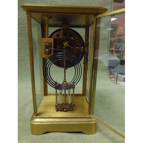 98 - Large 19th century brass carriage clock, having floral enamel face with Arabic numerals. 10 x 6 x 5